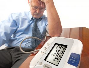 Upper arm monitor taking blood pressure readings